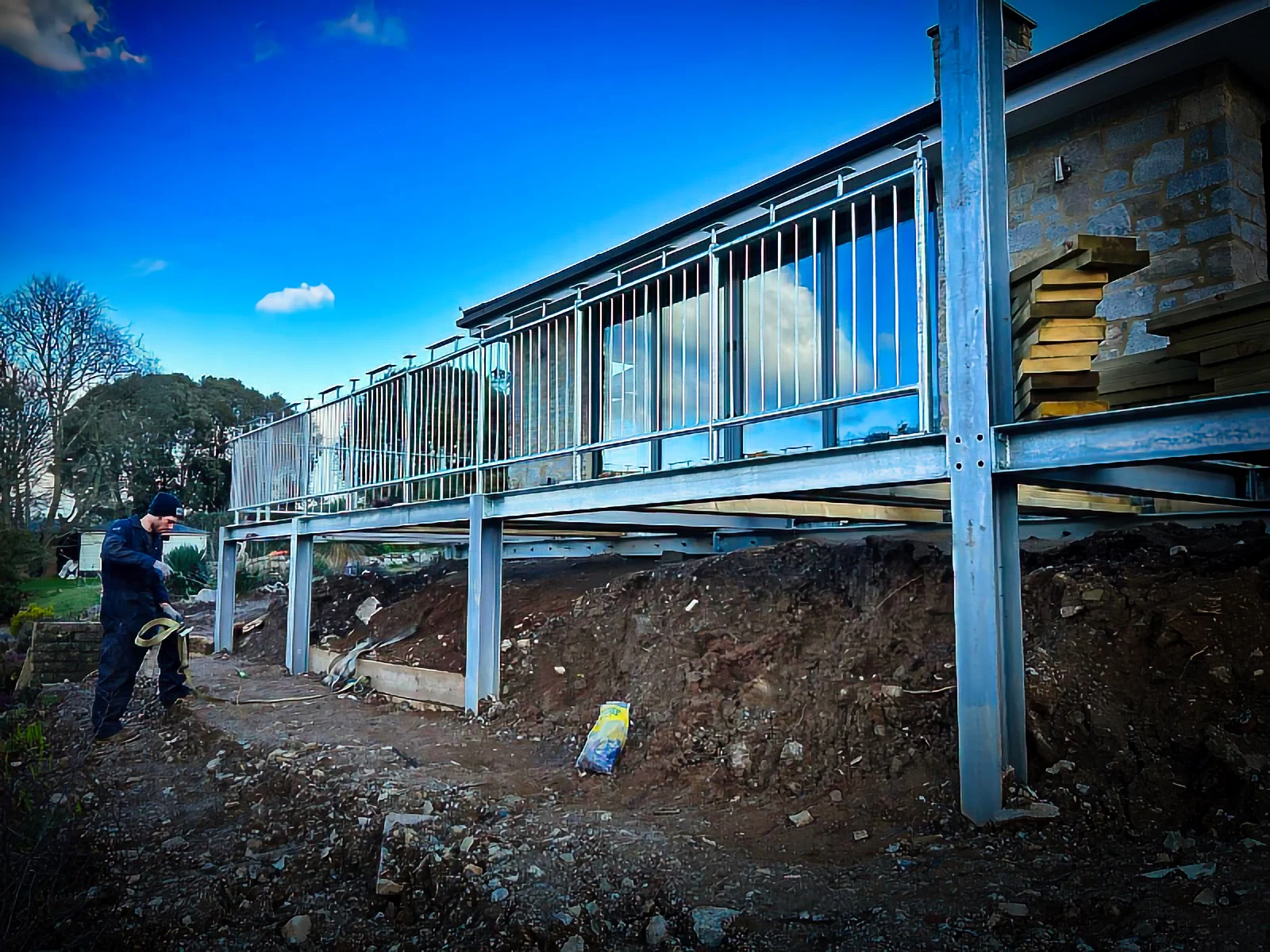 Galvanised steel balcony frame and balustrade being installed on a new build